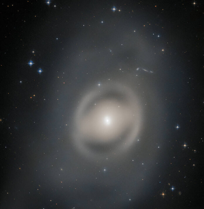 Portrait of a Ghostly Galactic Peacock Hubble spots ghostly lenticular galaxy NGC 6684