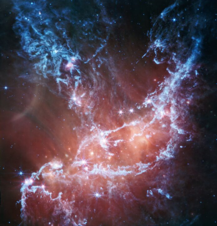NGC 346 (MIRI image) This new infrared image of NGC 346 from the NASA/ESA/CSA James Webb Space Telescope’s Mid-Infrared Instrument (MIRI) traces emission from cool gas and dust.