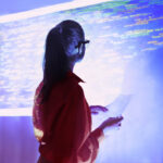 Woman looking at wall with code