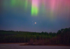 Rare Celestial Alignment: Mars, Beehive Cluster, and Aurora Paint the Night Sky